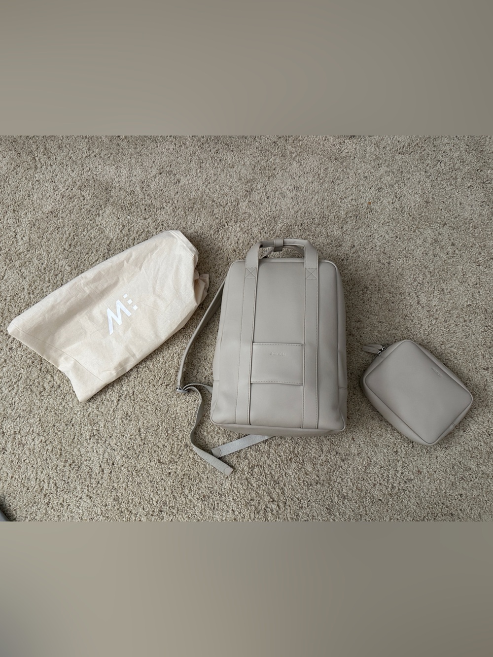 Monos Metro backpack in Ivory with care kit